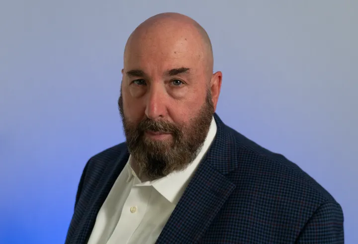 Neal McLoughlin, host of Badge and Bites
